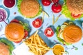 Various burgers set on blue background Royalty Free Stock Photo