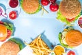 Various burgers set on blue background Royalty Free Stock Photo