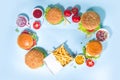 Various burgers set on blue background Royalty Free Stock Photo