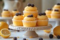 Various cakesÂ in yellow tonesÂ on dessert stand with soft lighting Royalty Free Stock Photo