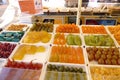 Various candies sold in the market in Nice, France, such as oranges, pomegranates, melons, and figs Royalty Free Stock Photo