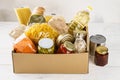 Various canned food, pasta and cereals in a cardboard box Royalty Free Stock Photo