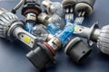 Various Car electric bulbs for parts in headlight on dark background. many new 12v car filament diod led halogen lamps