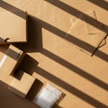 Various cardboard boxes and envelopes are arranged on a light brown surface. Sunlig Royalty Free Stock Photo
