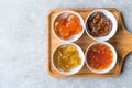 Various Ceramic bowl of Fruit jams Fig, Quince, Bergamot Citrus, Watermelon in wooden tray / Marmalade. Royalty Free Stock Photo