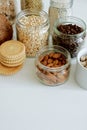 Various cereals, coffee, nuts, bran in glass jars.