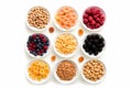 Various cereals placed in various bowls on white background, Various cereals on white background