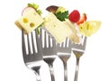 Various Cheese on Forks - White Background Isolated
