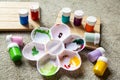 Various children`s paint pots with mixing tray. Family fun activity to keep kids busy whilst staying at home. Royalty Free Stock Photo