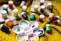 Various children`s paint pots with mixing tray. Family fun activity to keep kids busy whilst staying at home. Royalty Free Stock Photo