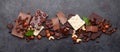 Various chocolate pieces, coffee beans and nuts Royalty Free Stock Photo