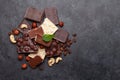 Various chocolate pieces, coffee beans and nuts Royalty Free Stock Photo