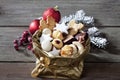 Various Christmas cookies in golden sacket on wooden background