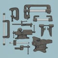 Various clamps and vises are arranged on a light blue background. Includes C-clamps, Royalty Free Stock Photo