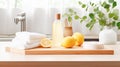 Various cleaning products, stack of towels, fresh lemon on wooden tabletop home interior, bathroom or kitchen