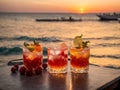 Various cocktails, sea view, sunset juice glasses fruit