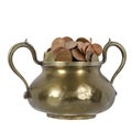 Various coins in brass goblet