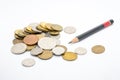 Various coins and pencil Royalty Free Stock Photo