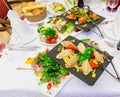 Various cold appetizers on the buffet: seafood, vegetables, meat, delicacies