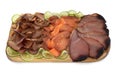 Various cold smoked fish slices: sturgeon, blue marlin, tuna on wooden board isolated