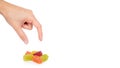 Various color of fruity gummy jelly candies in hand isolated on white background. copy space, template