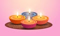 Various Color Lit Floral Diyali (Oil Lamp) on Rangoli at Pink Background. Indian Festival of Diwali Celebration Royalty Free Stock Photo