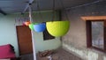 Various color plastic hanging flower pot. Hanging multicolor plastic pots in the house