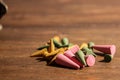 Various color and scent of cone incense on the wooden table Royalty Free Stock Photo