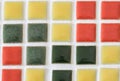 Various color of small tiles pasting on the board