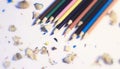 Various Color of Wooden Pencils and Shavings Top Corner View on a Pure White Background.Sorted Colorful Pencils with Selective