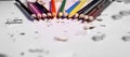 Various Color of Wooden Pencils and Shavings Top Corner View on a Pure White Background.Sorted Colorful Pencils with Selective