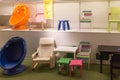 Various colored chairs on shelves