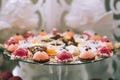 Various colored delicious sweets in a candy bar at a wedding. Sweet table. Wedding buffet. Royalty Free Stock Photo