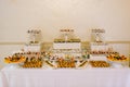 Various colored delicious sweets in a candy bar at a wedding. Sweet table. Wedding buffet Royalty Free Stock Photo