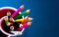 colored pencils  on blue background Royalty Free Stock Photo