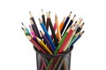 Various colored pencils standing in grilled pencil cup Royalty Free Stock Photo
