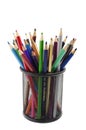 Various colored pencils standing in grilled pencil cup Royalty Free Stock Photo