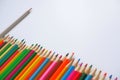 Various colored pencils on a white background. Royalty Free Stock Photo