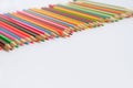 Various colored pencils on a white background. Royalty Free Stock Photo