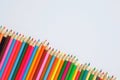 Various colored pencils on a white background. Royalty Free Stock Photo