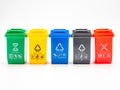 Various colored recycle bins for different type of trash on white, recycling environment protection concept Royalty Free Stock Photo