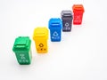 Various colored recycle bins for different type of trash on white, recycling environment protection concept Royalty Free Stock Photo