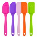 Various Colored Silicone Spatulas Kitchen Utensils in a Row on White Background Royalty Free Stock Photo