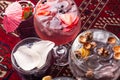 Various colorful alcoholic cocktails. Various fresh alcoholic cocktails. Dark red glasses space. Top view