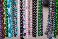 Various colorful beads in the market. Wallpaper background of a colorful necklace made of precious stones and colored beads Royalty Free Stock Photo