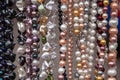 Various colorful beads in the market. Wallpaper background of a colorful necklace made of precious stones and colored beads