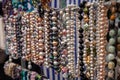 Various colorful beads in the market. Wallpaper background of a colorful necklace made of precious stones and colored beads Royalty Free Stock Photo