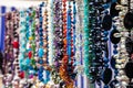 Various colorful beads in the market. Wallpaper background of a colorful necklace made of precious stones and colored Royalty Free Stock Photo