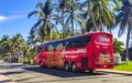 Various colorful buses tour bus transport in Puerto Escondido Mexico