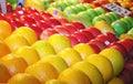 Various colorful fresh fruits on market stand